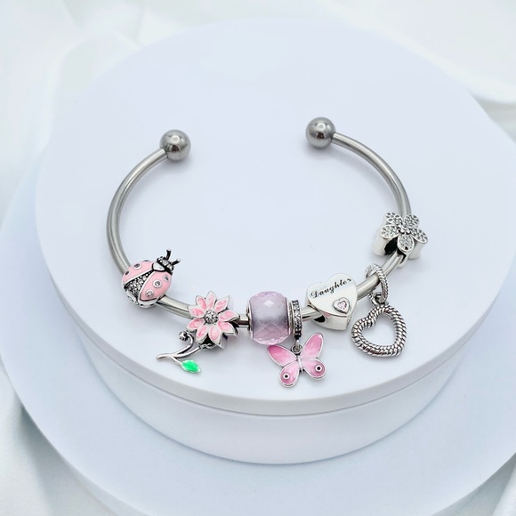 Linx Stainless Steel Open Bangle with Pink Daughter Themed Charms